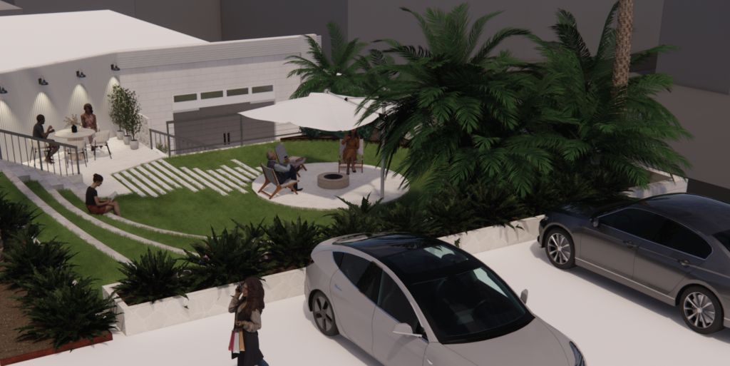Tiered grass terraces and circular fire-pit seating in a commercial motel courtyard landscape design, Merimbula NSW